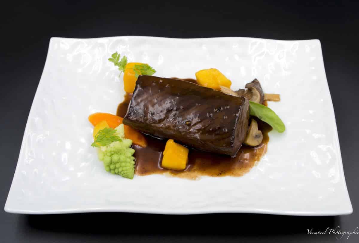 Leg of venison with mango juice and pepper reduction