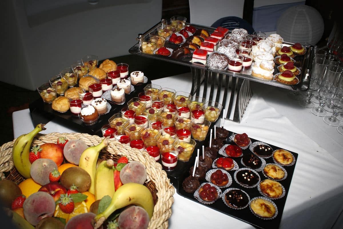 Wedding desserts: Chocolate lollipops, strawberry tarts, fresh fruit salad, rum baba