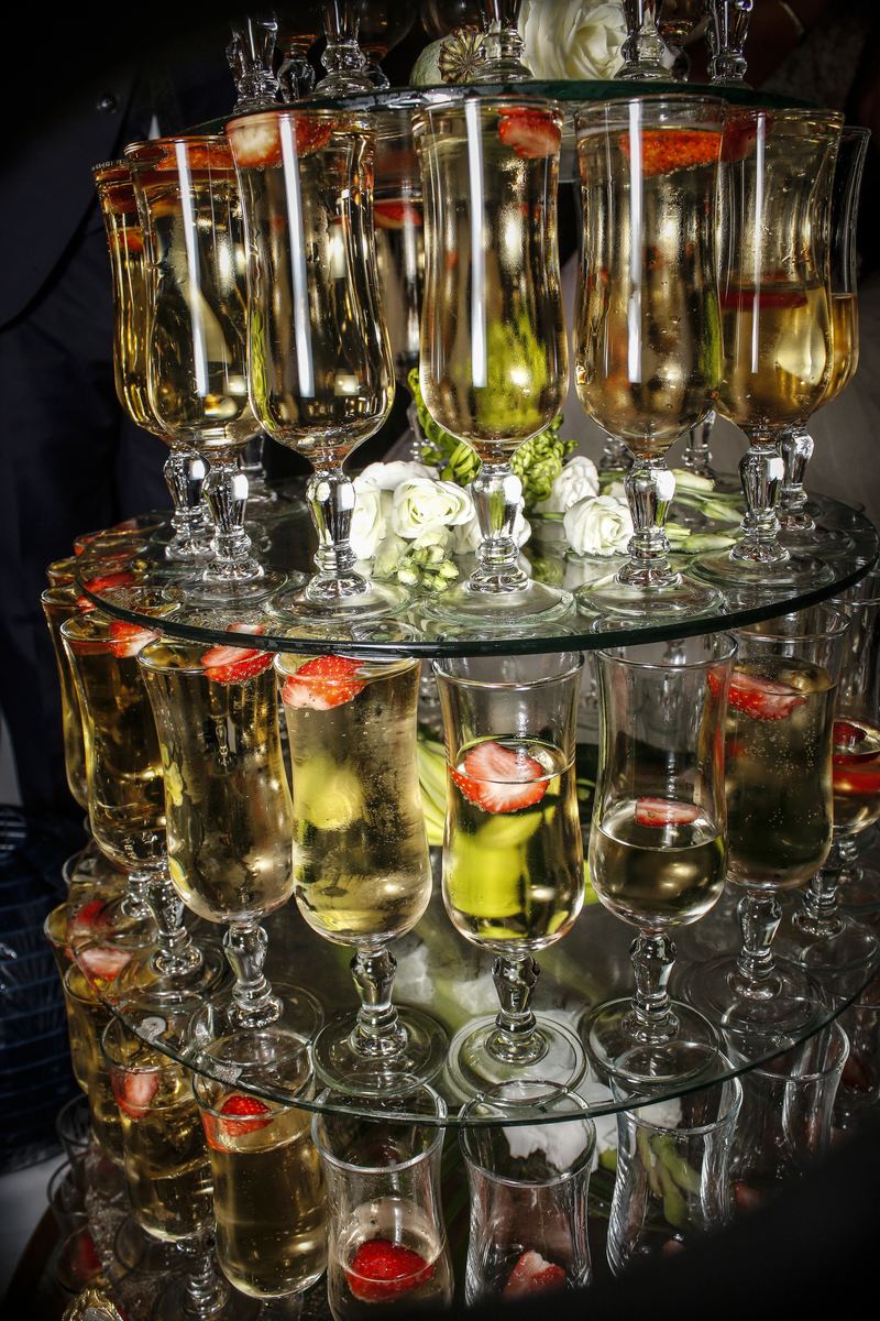 Champagne glasses with fruit pieces